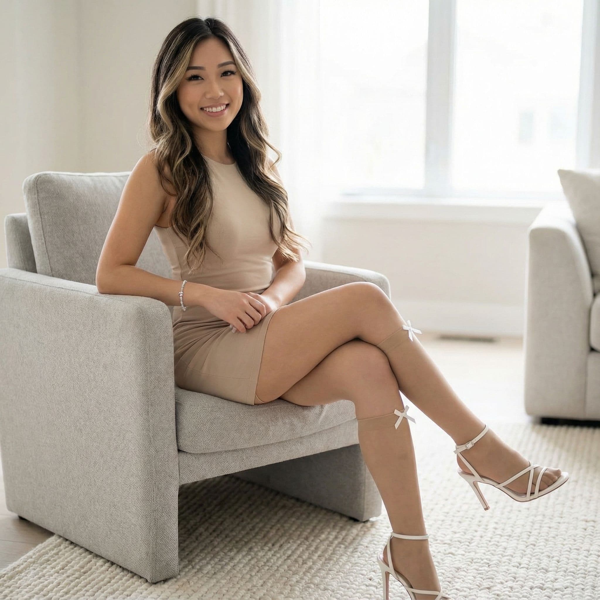 صورة مولدة بالذكاء الاصطناعي: Nano Banana prompt: young Asian woman seated in a modern, light gray a... (نموذج Nano Banana - Nano Banana)