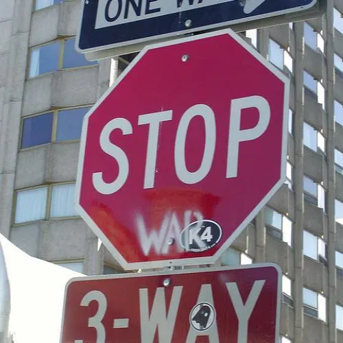 turn the stop sign into a no parking sign before
